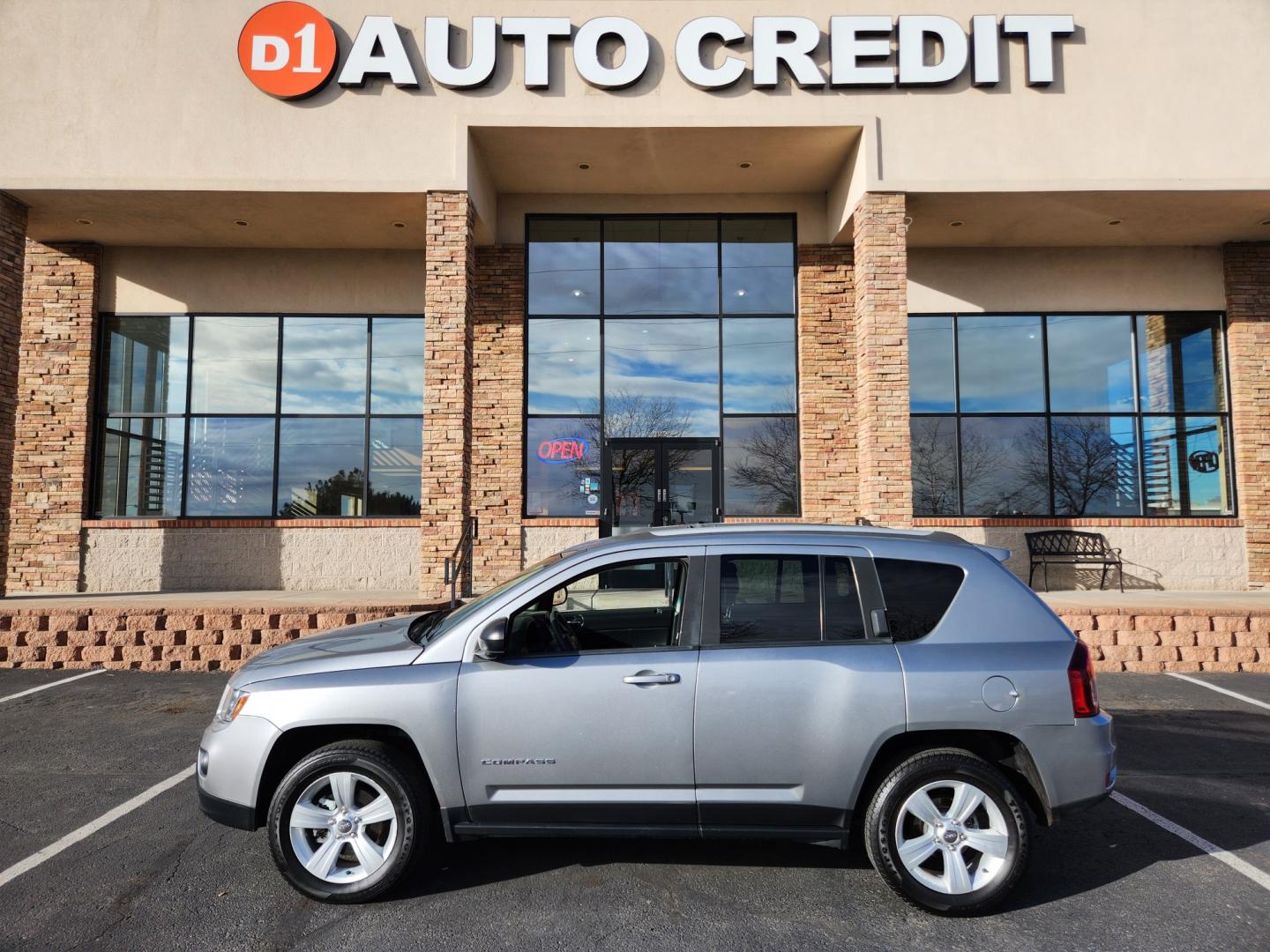 2015 Billet Silver Metallic Clearcoat /Dark Slate Gray Jeep Compass Sport (1C4NJDBB9FD) with an 2.4L I4 DOHC 16V Dual VVT engine, Automatic transmission, located at 10890 W. Colfax Ave., Lakewood, CO, 80215, (303) 274-7692, 39.739914, -105.120132 - 2015 Jeep Compass<br><br>D1 Auto NEVER charges dealer fees! All cars have clean titles and have been inspected for mechanical issues. We have financing for everyone. Good credit, bad credit, first time buyers.<br><br>Please call Lakewood Location 303-274-7692 or Thornton 303-287-5511 to schedule a t - Photo#0